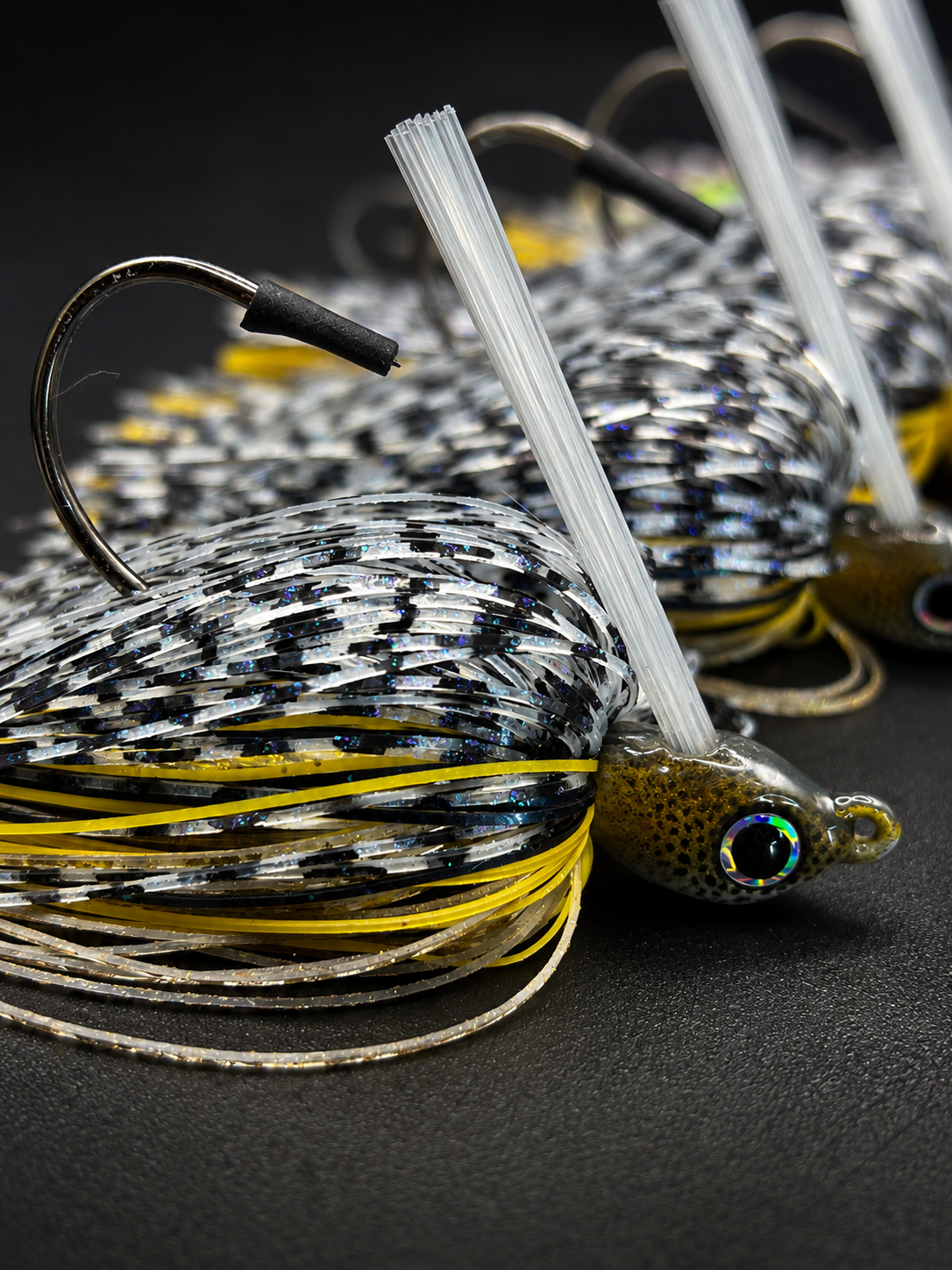 Close-up of 3/8 oz Golden Shad Swim Jig head, skirt, weed guard, and hook